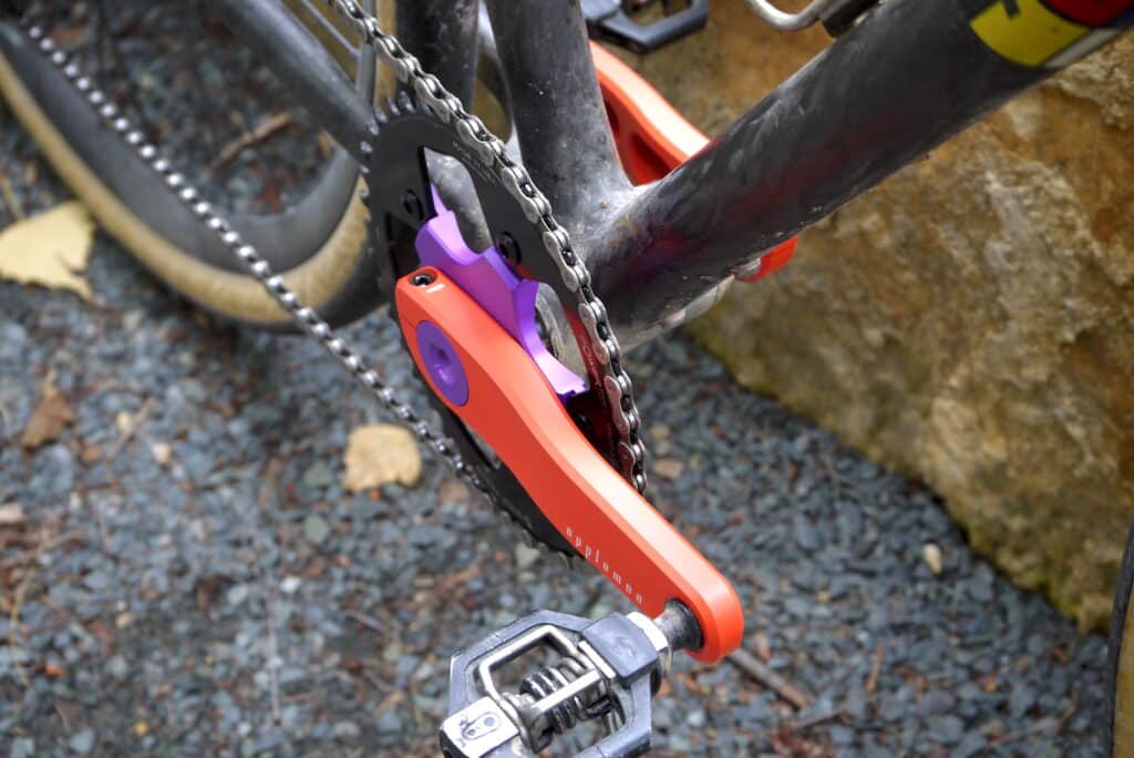 Appleman gravel crankset, orange crank arms, purple spider