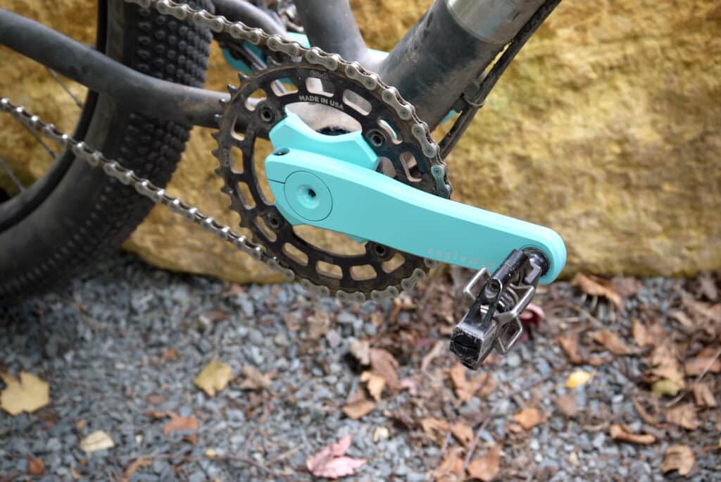 Turquoise mountain bike cranks the Appleman 2XR with granite rock background