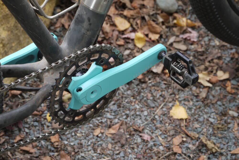 Appleman 2XR crankset on mountain bike in turquoise with leaves in background